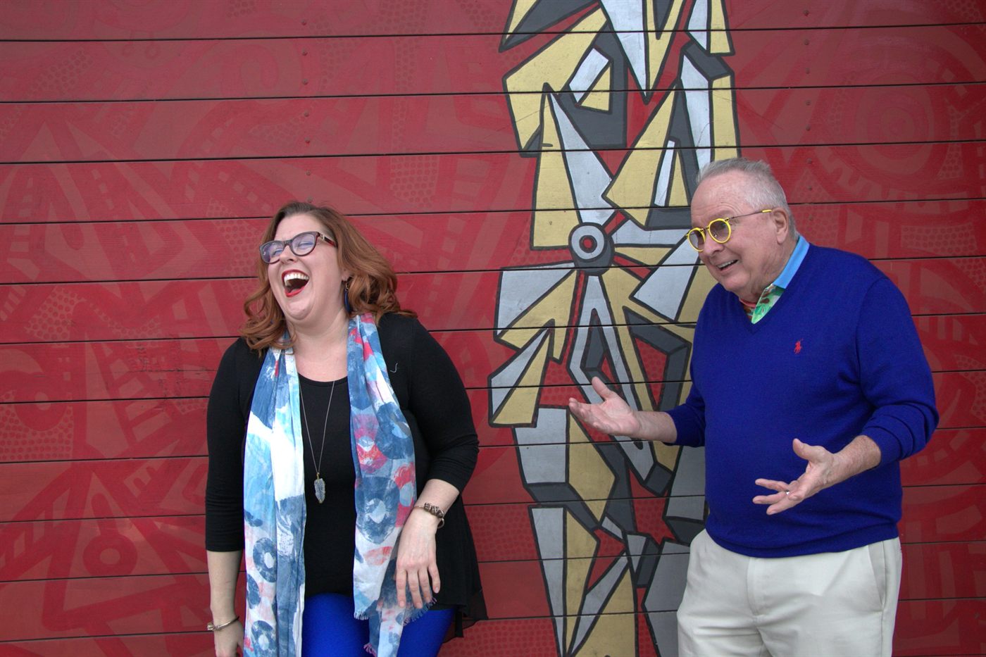 Jenn Quader and Dr. Dennis Michels sharing a laugh while working together in the studio.